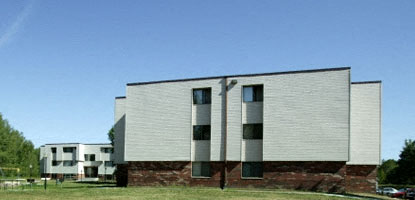a white building with three columns on it